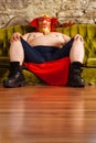 Luchador sitting on a couch