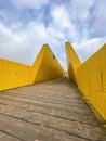 The Luchtsingel is a yellow-painted wooden footbridge in Rotterdam, NL