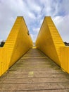 The Luchtsingel is a yellow-painted wooden footbridge in Rotterdam, NL