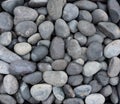 Lucido Nero black natural pebble background. Texture of black smooth stones. Natural pebbles for landscaping Royalty Free Stock Photo