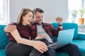 Luck, happiness, joy, victory, won, happy emotional middle aged couple looking in laptop Royalty Free Stock Photo