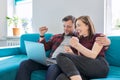 Luck, happiness, joy, victory, won, happy emotional middle aged couple looking in laptop Royalty Free Stock Photo