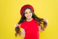 Lucky and beautiful. Kid happy cute face adorable curly hair yellow background. Beauty tips for tidy hair. Smiling child Royalty Free Stock Photo