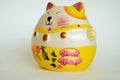 Lucky Cat Doll The symbol of good fortune in trading Maneki Neko Royalty Free Stock Photo