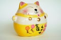 Lucky Cat Doll The symbol of good fortune in trading Maneki Neko Royalty Free Stock Photo