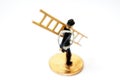 Lucky charm, chimney sweep with ladder stands on coins as a symbol of happiness for prosperity and wealth