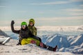 Lucky couple snowboarders