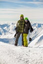 Lucky couple snowboarders