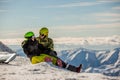 Lucky couple snowboarders