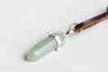 Lucky green aventurine semiprecious stones necklace isolated above white marble stone