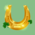 Lucky horseshoe and clover. Golden shiny horseshoe