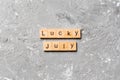 Lucky july word written on wood block. Happy july text on table, concept Royalty Free Stock Photo