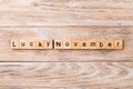 Lucky november word written on wood block. lucky november text on table, concept Royalty Free Stock Photo