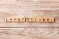 Lucky october word written on wood block. lucky october text on table, concept Royalty Free Stock Photo