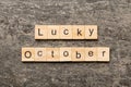 lucky october word written on wood block. lucky october text on table, concept Royalty Free Stock Photo