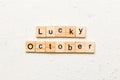 lucky october word written on wood block. lucky october text on table, concept Royalty Free Stock Photo