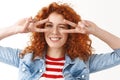 Lucky optimistic caucasian ginger girlfriend curly hairstyle look playful upbeat show disco signs peace victory gesture