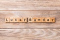 Lucky sunday word written on wood block. lucky sunday text on wooden table for your desing, concept Royalty Free Stock Photo