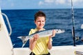 Boy deep sea fishing Royalty Free Stock Photo