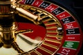 Lucky thirteen and casino gambling concept with a closeup on a section of the of roulette wheel with the ball in the winning Royalty Free Stock Photo