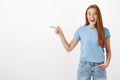 So lucky to visit awesome place. Portrait of charming pleased and happy entertained good-looking redhead girl with Royalty Free Stock Photo