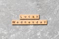Lucky wednesday word written on wood block. lucky wednesday text on cement table for your desing, concept Royalty Free Stock Photo