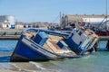 Luderitz, Namibia - July 08 2014: Shipwreck or sunk fishing boat stranded in harbor of Luderitz