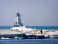 Ludington`s North Breakwater Light in Mason County, Michigan Lighthouse in the Winter with sightseers.