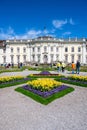 Ludwigsburg royal palace historic building in spring time with beautiful garden with flower and green grass and blue sky