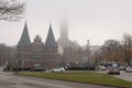LUEBECK, Germany. Holsten Gate Holstentor and St. Petry zu Luebeck  in fog. Royalty Free Stock Photo