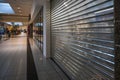 Luebeck, Germany, January 25, 2021: Closed stores in the hallway of a shopping center during the lockdown in the coronavirus