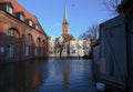 LUEBECK, GERMANY, JANUARY 2, 2019: High water in the river Trave flooded the historic old town of Luebeck, Germany, blue sky,