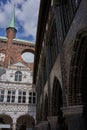 Luebeck, Germany - July 20, 2021 - The dark bricks of the Town Hall make a striking contrast to the traditional red-brick