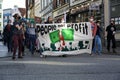 Luebeck, Germany, March 25, 2022: Fridays for Future demonstration on the street in the city, protesters carry a banner showing a