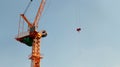Luffing jib tower crane soars into blue sky Royalty Free Stock Photo