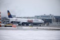 Lufthansa Airbus A340-600 D-AIHZ doing taxi Munich Airport,winter time, FC Bayern livery Royalty Free Stock Photo