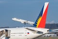 Lufthansa Airbus A321-231 jet and a Philippines Boeing 777-3F6-ER in Zurich in Switzerland