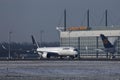 Lufthansa Airbus plane taxiing on runway, snow