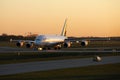 Lufthansa Airbus A380 plane taxiing at sunset