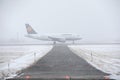 Lufthansa Airbus taxiing in Munich Airport, snowy runway