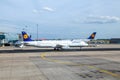 Lufthansa aircraft parking at the apron in Frankfurt, Germany. There is Lufthansas primary traffic hub and the majority of Royalty Free Stock Photo