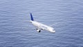 Lufthansa airplane flying over the sea. Conceptual editorial 4K clip