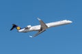 Lufthansa CityLine Bombardier CRJ-900LR with the aircraft registration number D-ACKD during take off on the southern runway 08R of Royalty Free Stock Photo
