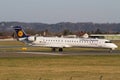 Lufthansa Cityline regional jet CRJ900 lining up the runway in Graz Royalty Free Stock Photo