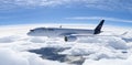 Lufthansa commercial Aeroplane flying in the sky above the mountains