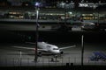 Lufthansa plane heading to terminal gate, night view, Munich