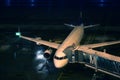 Lufthansa plane at terminal gate, night view, Munich