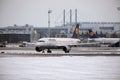 Lufthansa plane doing taxi in Munich Airport in winter Royalty Free Stock Photo