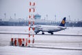 Lufthansa plane doing taxi in Munich Airport in winter Royalty Free Stock Photo