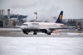 Lufthansa plane doing taxi in Munich Airport in winter Royalty Free Stock Photo